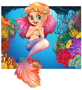 Cute mermaid swimming under the sea