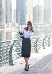 Fototapeta premium Business woman accepting a phone call.
