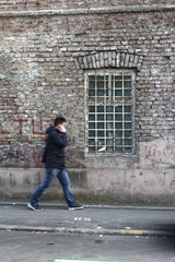 Fototapeta na wymiar textured wall walking figure