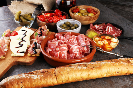 spanish tapas and sangria on wooden table - mediterran antipasti set