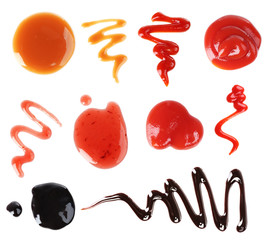 Set of different sauces on white background