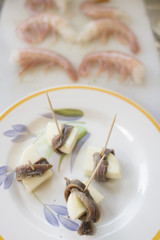 snacks with anchovies and cheese