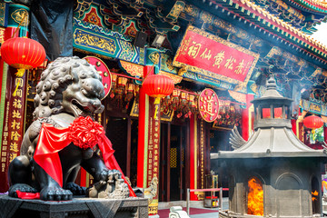 Burning incense in Wong Tai Sin Temple in Hong Kong - obrazy, fototapety, plakaty