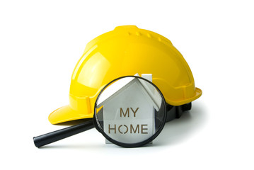 isolated of yellow safety cap and home with lens