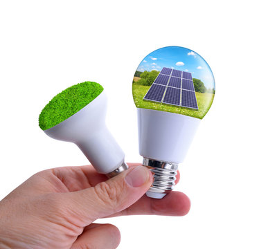 Hand holding eco LED bulbs isolated on a white background. The concept of sustainable resources.