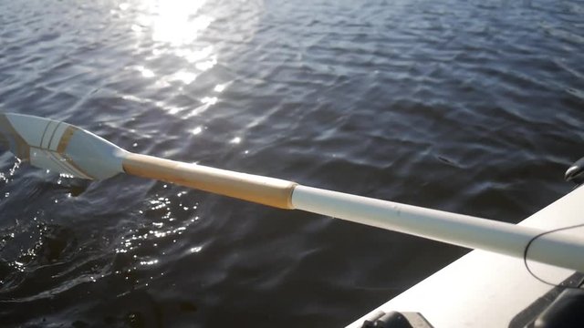Handpainted Vintage Wooden Oar Pull Lake Water and Make Splashes. HD Slowmotion Nature Lifestyle Footage.