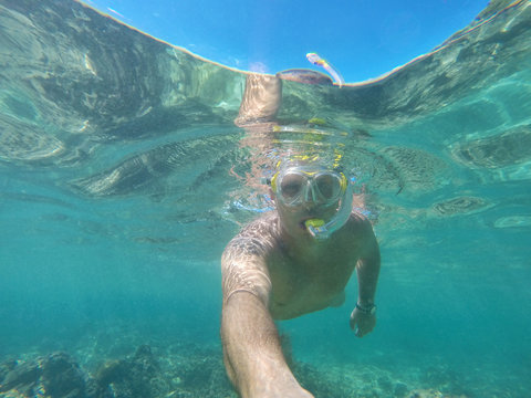 Scuba diver with mask underwater