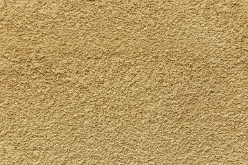 Texture yellow plastered wall for background
