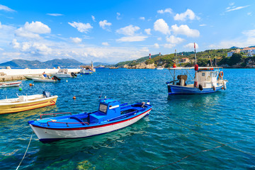 Fototapeta na wymiar Typical fishing boats in Kokkari port on beautiful summer day, Samos island, Greece