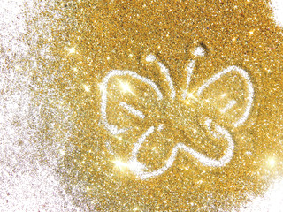 Butterfly on the golden glitter.  Beautiful background for your design