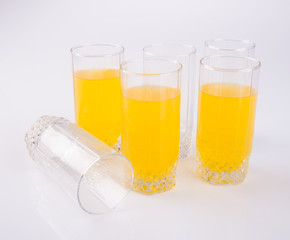 Orange juice in glasses on white background.