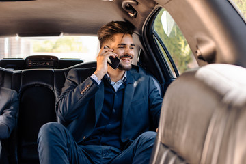 Young businessman in limo