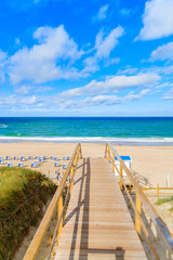 Fototapeta premium Walkway to beautiful beach in Westerland village on Sylt island, North Sea, Germany