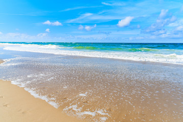 Beautiful sea waves on Kampen beach on sunny summer day, Sylt island, North Sea, Germany