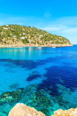 Blue azure sea water on coast of Cala San Vicente bay in northern part of Ibiza island, Spain