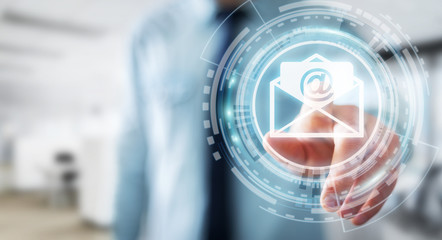 Businessman touching 3D rendering flying email icon with his finger