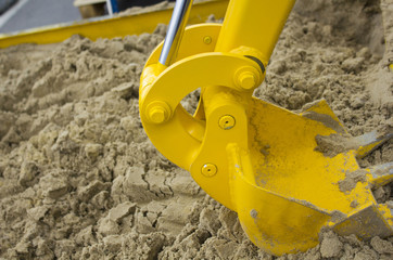 Big yellow bucket scoop at digger machine