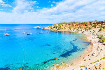 Fototapeta na wymiar View of Cala d'Hort beach with beautiful azure blue sea water, Ibiza island, Spain