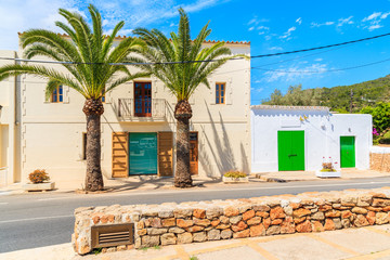 Street with typical architecture of Sant Carles de Peralta village with colourful houses, Ibiza island, Spain © pkazmierczak