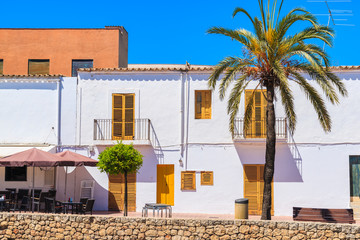 Typical Spanish style houses and palm tree on street of Sant Josep de sa Talaia town, Ibiza island, Spain © pkazmierczak