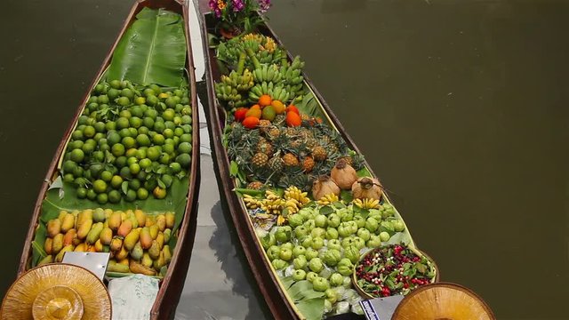 Fruits and vegetables were sold on boat the Damnoen saduak floating market is famous in Thailand