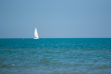 Obraz premium Sailing Ship yachts with white sails in the open Sea