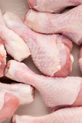 Fresh chicken leg,  meat on plate.With spices.