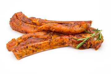 Spicy marinated spare ribs barbecued on the white background.