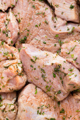 Fresh pork meat pieces in marinade.