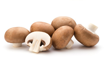 Fresh champignon mushrooms isolated on white.