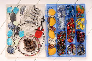 assortment of female accessories, bijouterie is in box, beads, earrings and  necklace