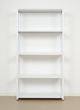 white metal rack near the wall, empty shelves