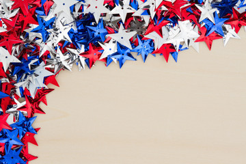 USA red, white and blue stars on wood background