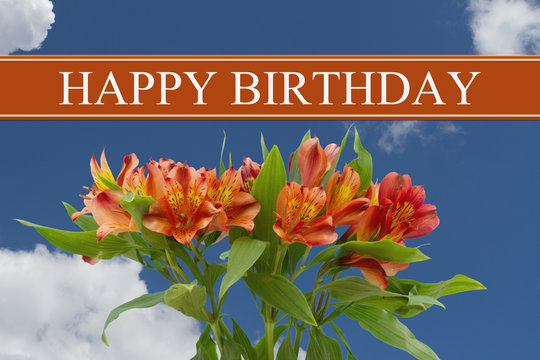 Happy Birthday greeting with a orange and yellow lilies bouquet