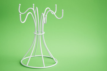 Empty White Coffee Mug Hanger on a White Hanger