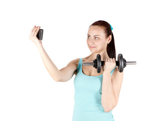 Fitness sports woman holding dumbbell and taking selfie