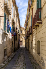 Fototapeta na wymiar Narrow street and church in downtown Tropea - Tropea, Calabria, Italy