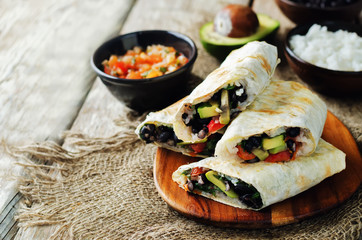 Rice black bean avocado tomato burritos
