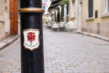 crest of Gibraltar on a street post