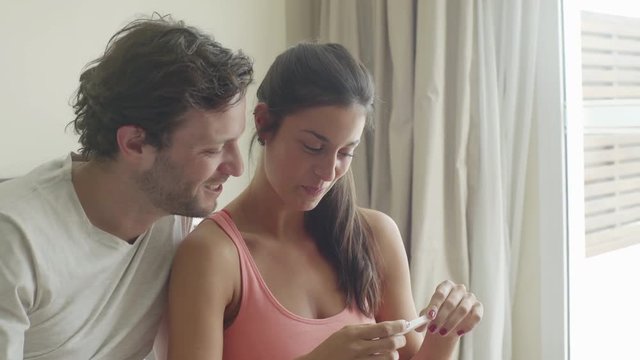 Couple pleased with pregnancy test results