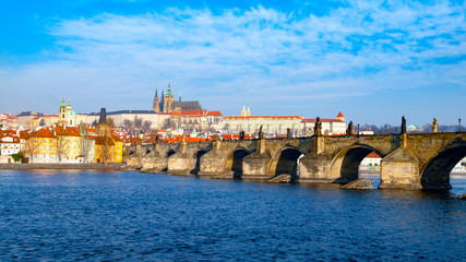 Prague Hradcany Panorama on sunny day. Charles Bridge over Vltava River with Prague Castle, Czech Republic.