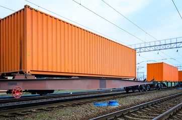 Obraz premium Transportation of cargoes by rail in containers. Railway infrastructure background