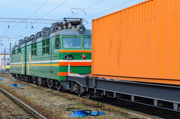Obraz premium Transportation of cargoes by rail in containers. Railway infrastructure background
