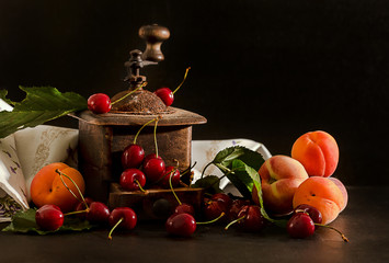 cherries, apricot and peaches withvintage coffee grinder
