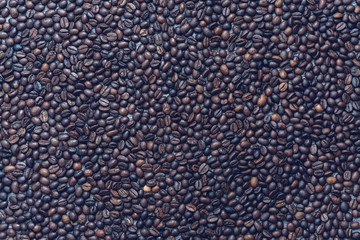 Coffee beans on wooden surface.Background with coffee