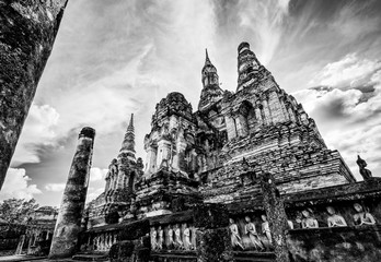 Black and white two tone vintage style, Ancient chapel among the ruins under the bright sky at Wat Maha That temple in Sukhothai Historical Park landmark of Sukhothai Province, Thailand
