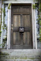 Weathered wooden door on old house 