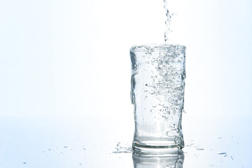 Over pouring water in glass