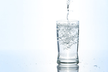 Pouring water in glass