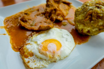 Bolon de verde with fried eggs and meat stew ecuadorian food galapagos